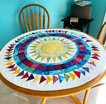 Wendy Norman  Whether you love New York Beauties or not, this quilt is sure to please! We love the stunning table topper Wendy designed using EQ8, don't you?!  See more of Wendy's work on her Instagram, @wendellmakes