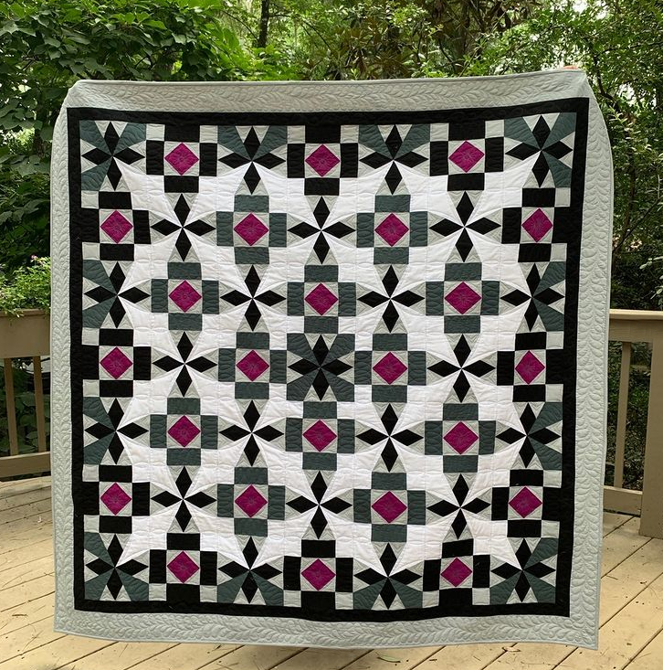 Gail Renna  Island Batik Ambassador, Gail Renna, designed this quilt in EQ for an AccuQuilt challenge. She says, “We were to create and give away a project made with the AccuQuilt BOB (Block on Board) die, combined with the GO! Qube 8″ Mix and Match Block. My BOB was Hattie’s Choice and I combined it with the Susannah block.“ We love it! See more of Gail's work on her Instagram, @quilthaventhreads