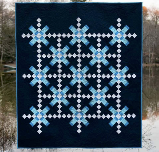 How pretty is this?! Cheryl's “Tahoe“ quilt, featuring Moda's Bella Solids, is a modern, lap sized quilt whose blocks come together quickly and easily using strip piecing. Her pattern is available for purchase on her website, Meadow Mist Designs!