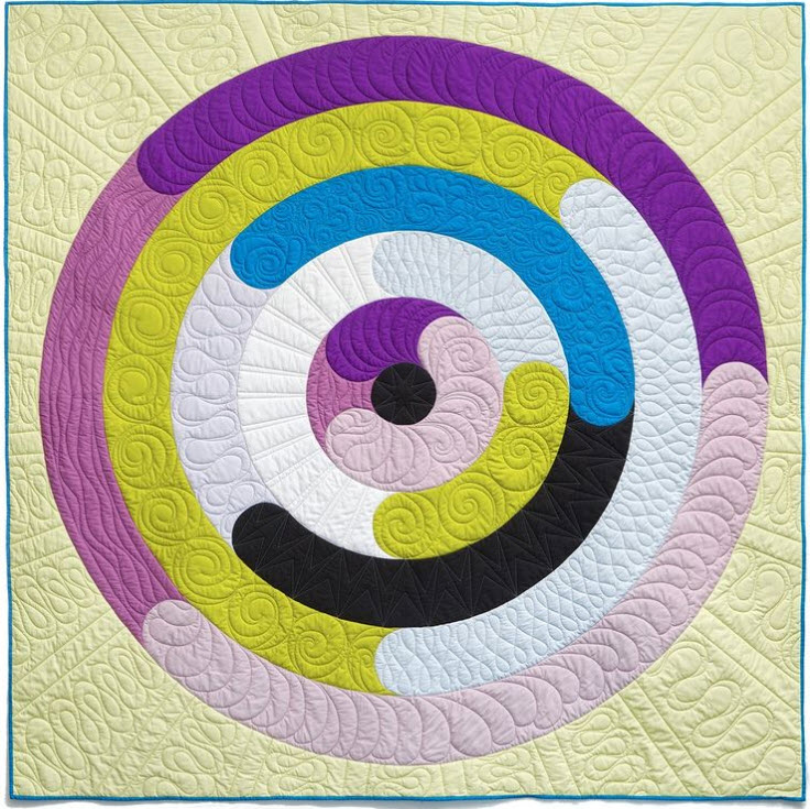 Bobbie Gentili  EQ user, Bobbie Gentili, created this unique, eye-catching quilt she named “Orbital“. Before designing this quilt, she wondered, “What if we did curves within strips, but the strips are actually rings??“ That was the idea behind Orbital. See more of Bobbie's work on her Instagram, @geekybobbin or read the full Orbital story on her blog.