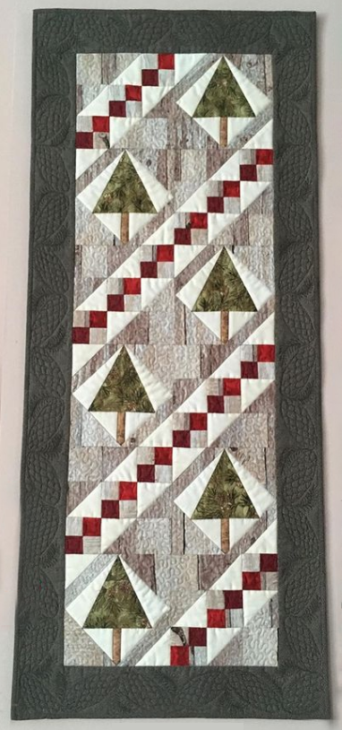 Anna Lukina  What a perfect quilt for this time of year! Anna designed this in EQ8 and calls it “еловый хоровод“ which translates from Russian to Spruce Round Dance in English. Can you see yourself rockin' around these trees? We can! See more of Anna's quilts on her Instagram, @ann_vbg
