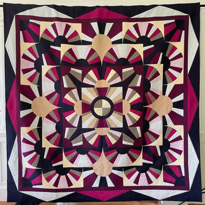 Rebecca Loren  We are huge fans of this curvy quilt! Rebecca's inspiration was a 1920's quilt. We love how she turned it into something modern with EQ! Visit her Instagram, @rebeccalorenquilts to see more eye-catching quilts like this one!