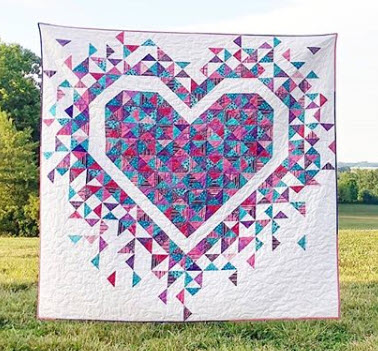 Laura Piland  We're bursting with excitement for Laura! How awesome is her Exploding Hearts quilt? See more pictures (and get the pattern if you want!) on her website, SliceofPiQuilts.com. You can also follow her on Instagram @sliceofpiquilts!