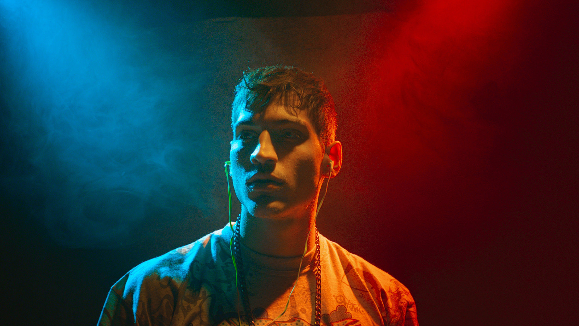 man with blue and red smoke