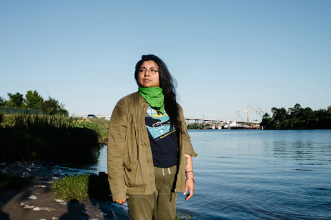 Yvette Arellano on the bank of Buffalo Bayou in industrial east Houston. Credit: Brandon Thibodeaux for The New York Times