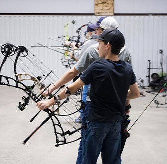 A group of people practicing archery.