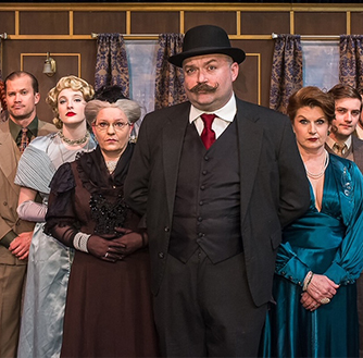 Theater actors of the live performance of “Clue“ pose for a photo. 