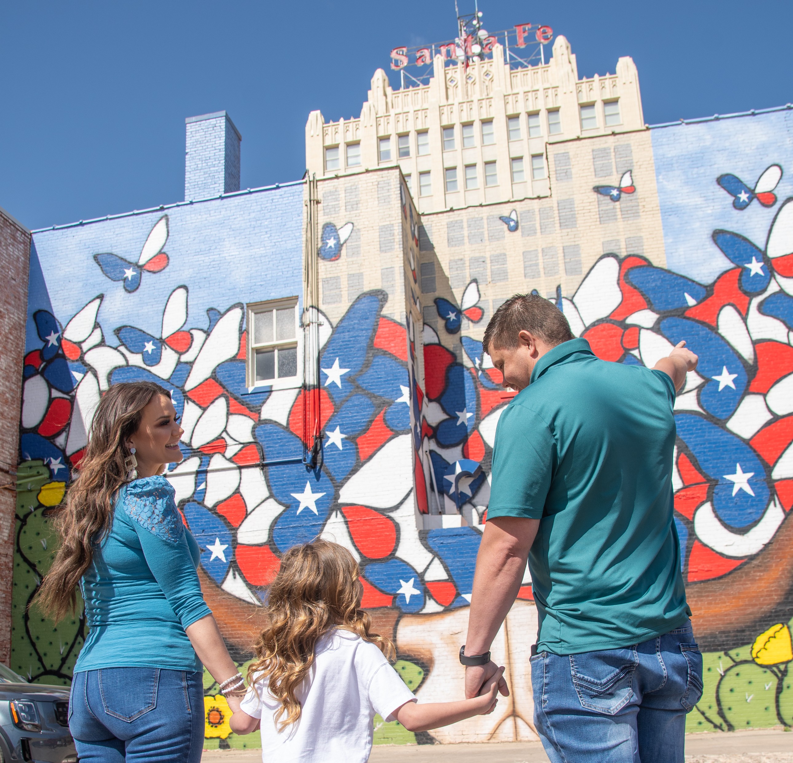 Family visits an outdoor mural in Amarillo.